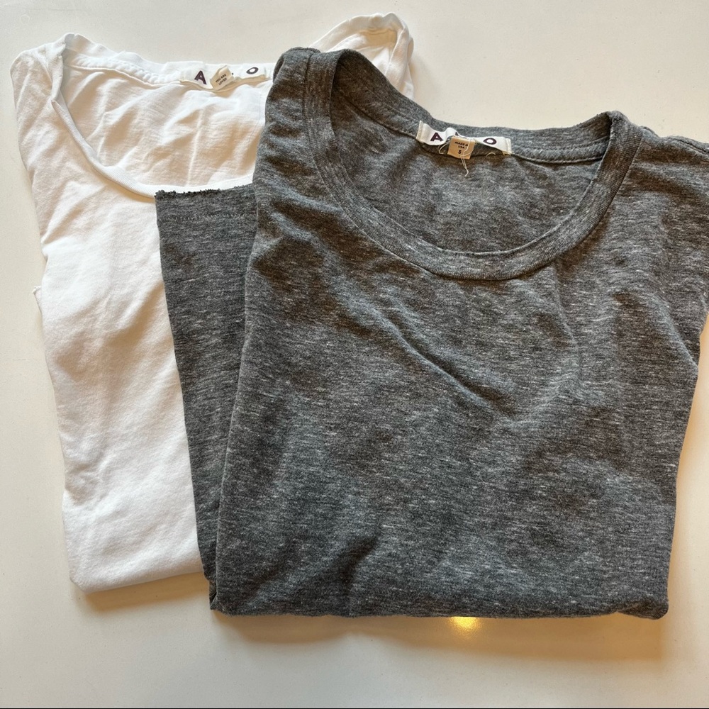 grey and white AMO “Twist Tee” t-shirt bundle (both size small)
